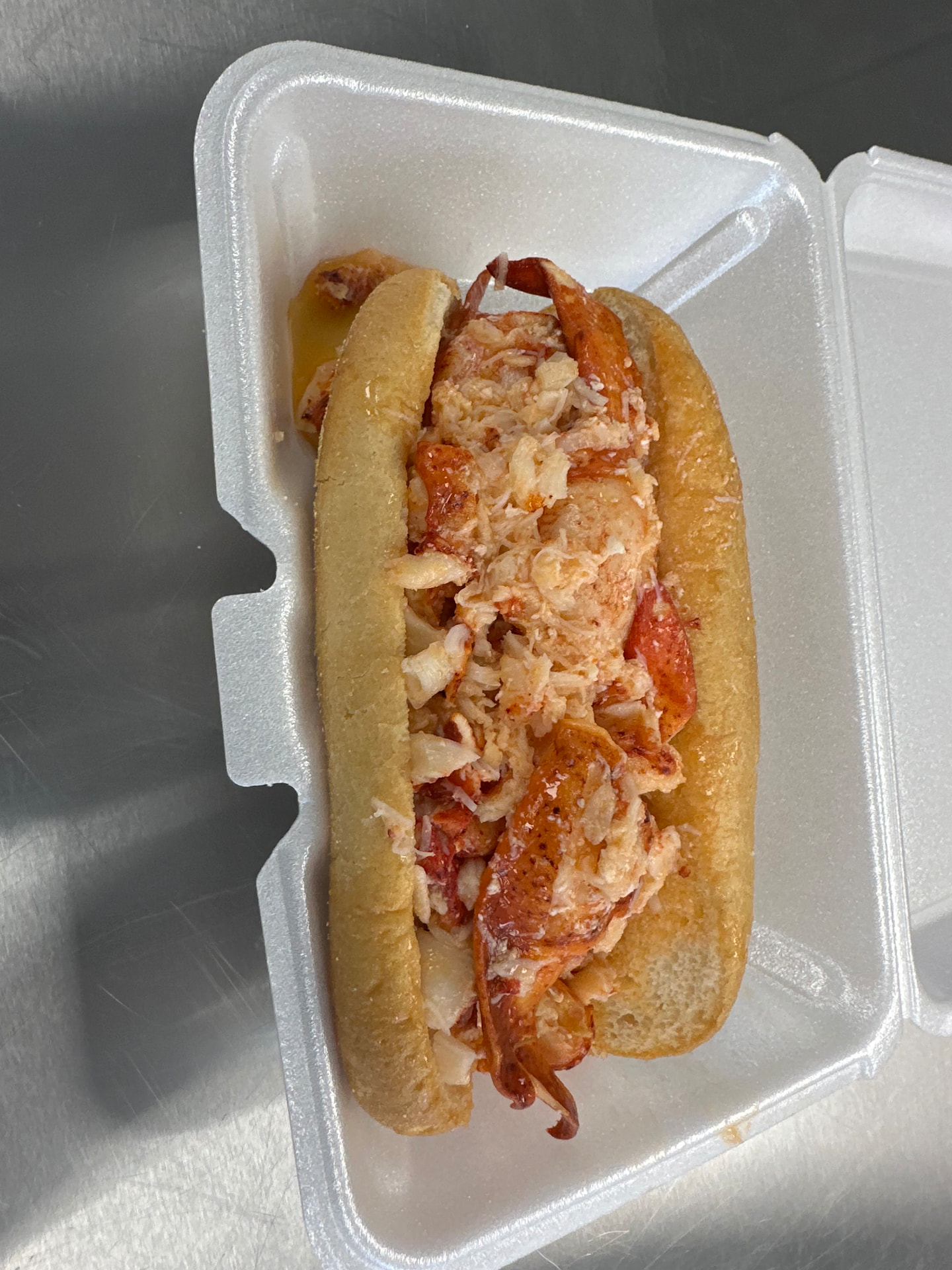 Hot lobster roll with drawn butter